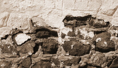 Old Stone Wall Texture Closeup. Aged Rough Masonry Detail Brown
