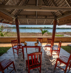 Fototapeta premium Sipping coconut water in a meadow by the Mekong River near Vientiane, Laos