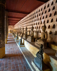 Cloister courtyard of the ancient Wat Si Saket Buddhist temple lined with thousands of Buddha figures of all sizes, Vientiane, Laos.
