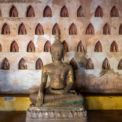 Ancient buddha figures among the thousands in the historical Wat Si Saket Buddhist temple, Vientiane, Laos.
