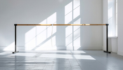 Empty ballet barre with natural light and window shadows