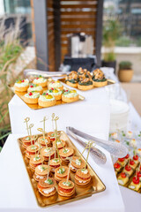 Top view of buffet table with canapes and mini tarts