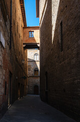 View of the streets of Siena, with its typical Tuscan architecture. Siena, Italy.