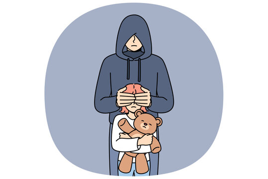 Maniac closes eyes of little girl with children toy, for public service announcement against pedophilia and child abduction. Criminal and hooded maniac wants to commit violent acts.