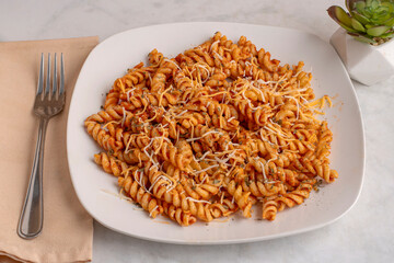 rotini pasta  with herbs and cheese