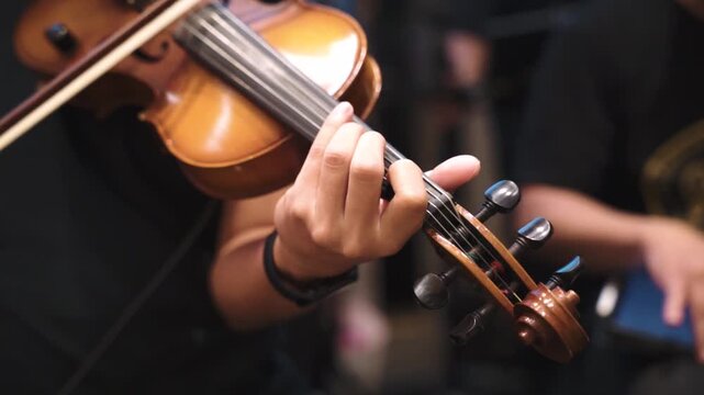 Violinist Playing in Dramatic Studio Lighting