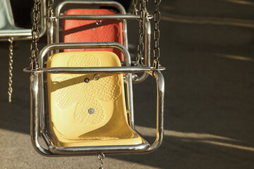 Vintage seats on the children's merry-go-round