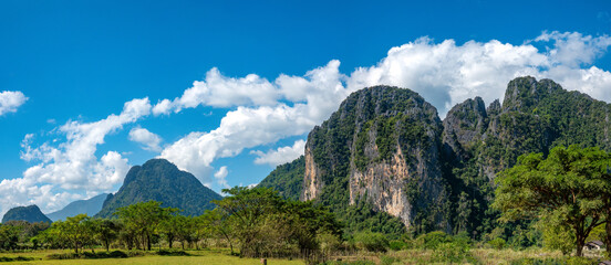 Hiking among the towering karst mountains of the Nam Song river valley near the resort town of  Vang Vieng, Vientiane Province, Laos