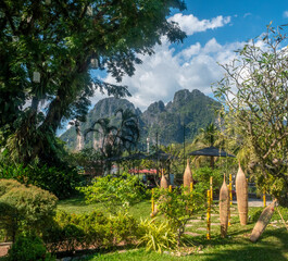 Street scenes in the resort city of Vang Vieng with its iconic towring karts mountains in the background, Vientiane Province, Laos