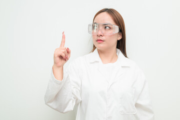 Portrait of Asian female research scientist against white background pointing finger