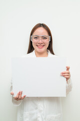 Portrait of Asian female research scientist against white background showing copy space