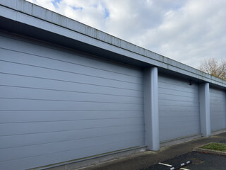Modern gray industrial warehouse building exterior with metal siding