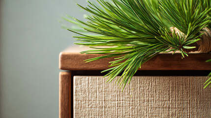 Pine needles resting on textured wooden surface