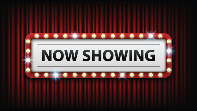 A movie theater sign that reads now showing