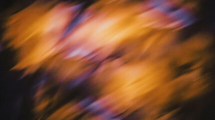 Abstract blurred background featuring warm orange and cool blue tones, creating a dynamic visual effect that evokes a sense of movement and energy in a vibrant atmosphere