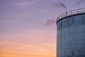 Industrial Crude Oil Chemistry Manufacturing background. Oil refinery chemical factory import and export concept. Chimneys and cooling towers, chemical petrochemical. Storage tank fuel oil industry 