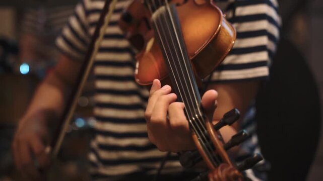 Violinist Playing in Dramatic Studio Lighting