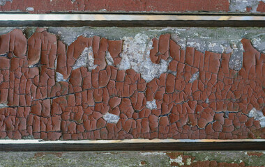 Rustic weathered wood texture with peeling paint.