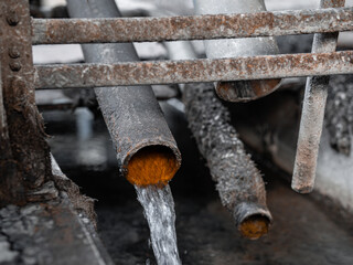 Industrial drainage system pipes discharges water. Flow line hot water from boiler station. Factory infrastructure technology. Wastewater sewage pipe dumps the dirty contaminated. Industrial plants 