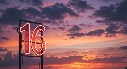 Vibrant neon number sixteen sign illuminating a dramatic cloudy sunset, showcasing rich hues of orange, pink, and purple across the vast horizon