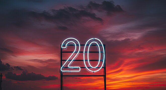 Neon sign displaying the number 20 against a dramatic sunset sky with clouds - Powered by Adobe