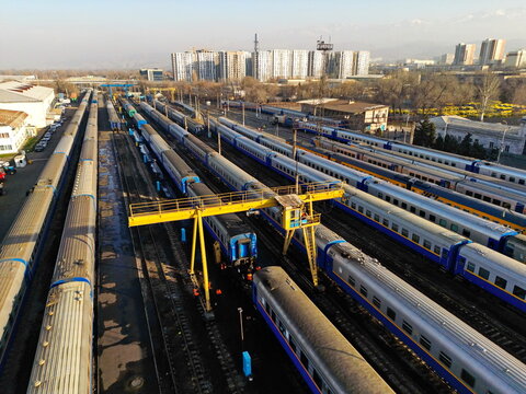 Almaty, Kazakhstan - 11.25.2025 : Railway tracks with passenger trains. Almaty Railway Station-2. The view from the drone.