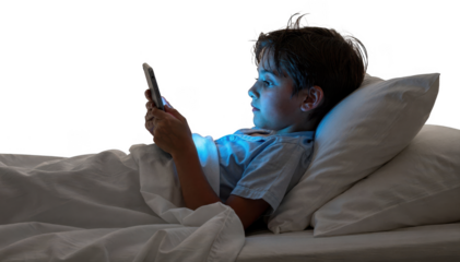 Side view of a teenager in bed illuminated by the soft blue light of a tablet screen against a white background.