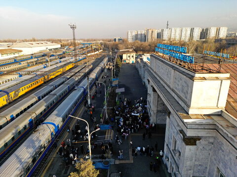 Almaty, Kazakhstan - 11.25.2025 : Railway tracks with passenger trains. Almaty Railway Station-2. The view from the drone.