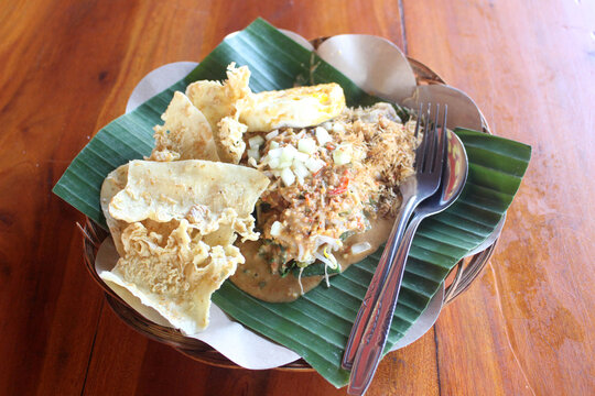 a plate of rice pecel