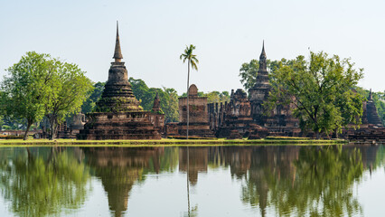Fototapeta premium Ancient Buddhist temple ruins reflected in calm water at UNESCO World Heritage site