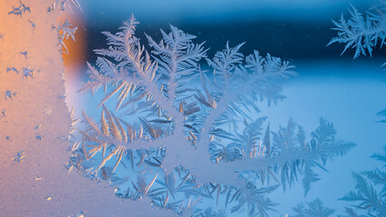 Frosted Window Ice Crystals with Warm Sunrise Light &ndash; Winter Abstract Background