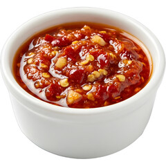 Close up of a small white bowl filled with vibrant red chili garlic sauce.