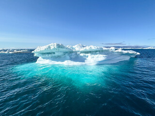 Deep Blue Iceberg Drifting Through Disko Bay Waters, Greenland © Michel