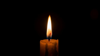 Bright, peaceful candle flame illuminates profound darkness, conveying solemnity, hope, and comfort.