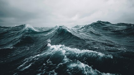 Vast expanse of choppy sea waves with crests breaking under a cloudy sky