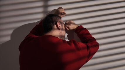 Man with headache, depression, sadness and loneliness at home