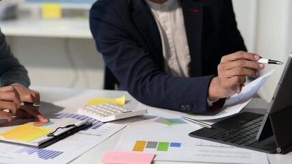 Business people analyzing financial data during meeting - Powered by Adobe