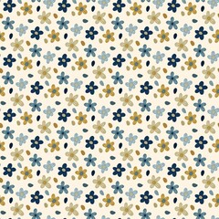 A seamless pattern featuring small, stylized flowers in muted tones of dark blue, light blue, and beige on a cream background, accented with small dark dots. 