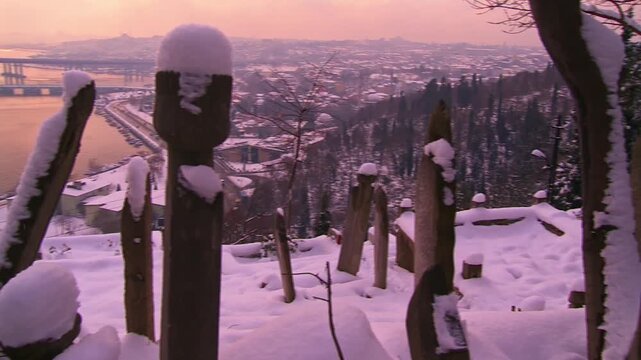 Snow Covered Historic Eyup Cemetery With the Golden Horn in the Background
