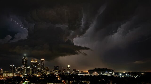 Dramatic Lightning Storm Over Atlanta City Skyline at Night With Dark Moody Clouds and Jagged Lightning Strikes Illuminating the Urban
