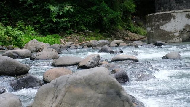 Java, Indonesia, South East Asia: Natural Stream Rocks Visible Through Clear Water