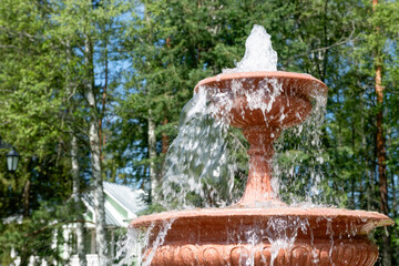 Fountain jets in a summer park on a sunny day