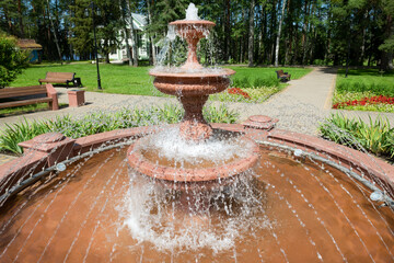 Fountain jets in a summer park on a sunny day