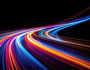 Long exposure shot of light trails curving across a black background, vibrant and dynamic