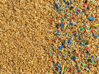 Microplastics Pollution Mixed with Beach Sand Close-Up