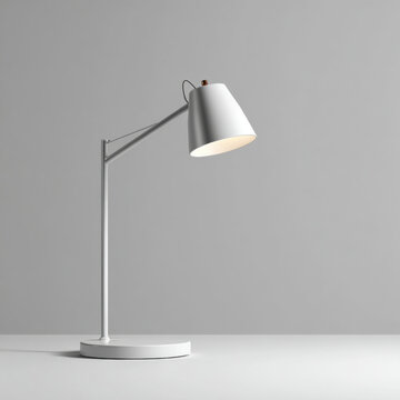 White modern desk lamp with adjustable arm casting warm light on minimalist surface, soft neutral mood