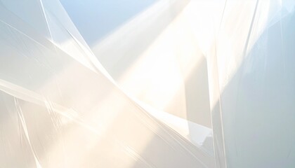 Luminous white abstract background showcasing subtle wrinkles and folds of plastic wrap texture catching brilliant sunlight creating soft warm glow and gentle blue gray color shift
