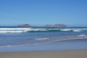 View on La Graciosa from Lanzarote, famara cliff, famara, lanzarote, canary islands, spain, November 2025, holiday, rocks, volcanic island, famara beach