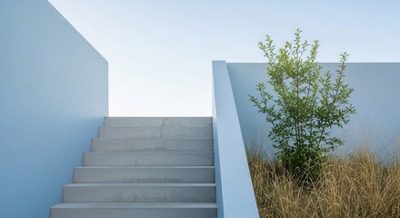 Concrete stairs ascend against pale-blue walls, flanked by greenery and grass showcasing minimalist architecture and a sense of calm and serenity