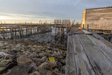 Carrasqueira palafitic port with wooden piers at sunset